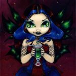Eyes of Absinthe has a gothic dark fairy with blue in her hair, wearing a blue gothic gown and green wings
