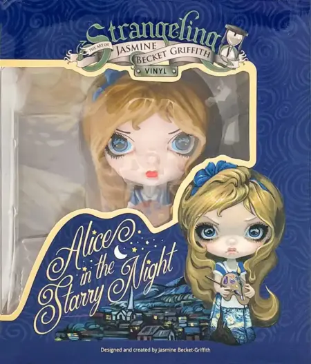 Alice in Van Gogh Starry night vinyl doll of Alice holding a painter's palette with Starry Night dress in the box