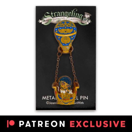 Egyptian Chariot enamel pin has an Egyptian queen in a hot air balloon basket with an ornate balloon on black logo card