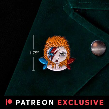Tiny Bowie fairy pin is an enamel pin of a big eyed fairy with one blue eye, one brown eye, blue and red sparkly wings and red and blue lightening bolt on its face